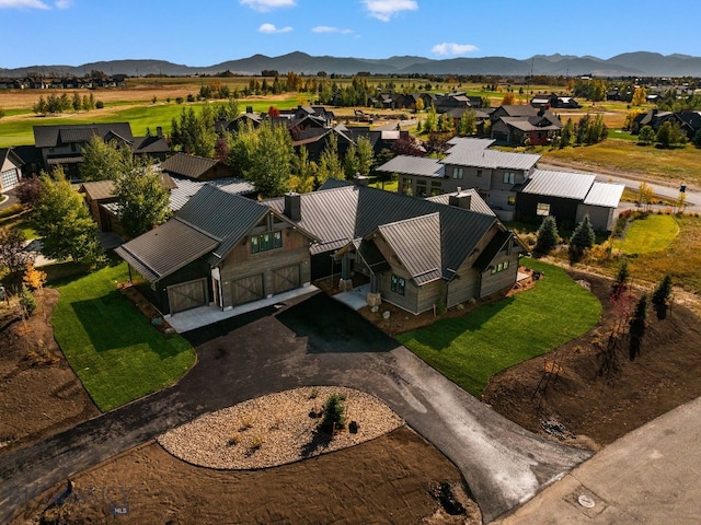 birds eye view of property featuring a mountain view