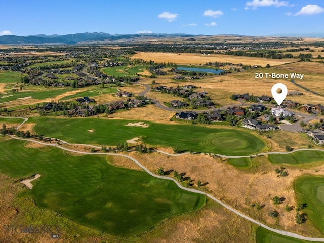 birds eye view of property with a mountain view