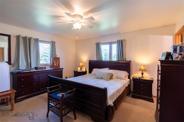 bedroom featuring ceiling fan and light colored carpet