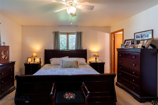 bedroom featuring light colored carpet and ceiling fan