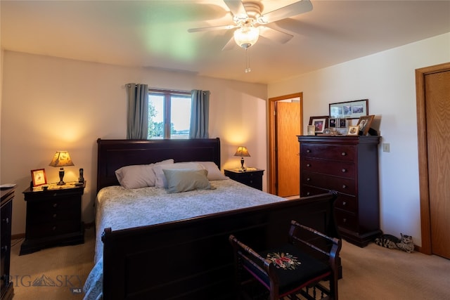 bedroom featuring ceiling fan and light carpet