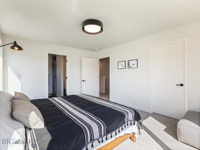 bedroom featuring carpet flooring and baseboards