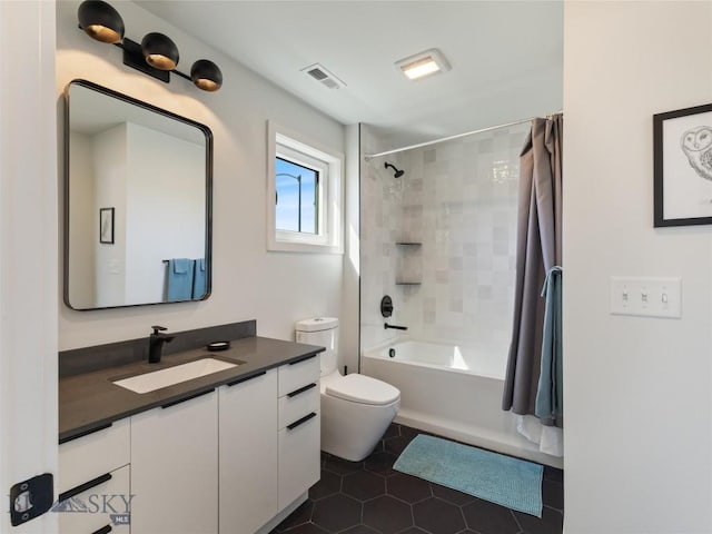 full bathroom with vanity, visible vents, shower / tub combo, toilet, and tile patterned floors