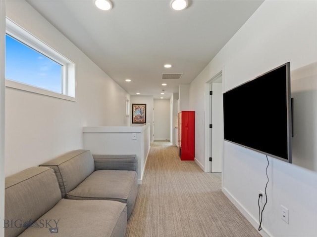 living room featuring baseboards, visible vents, light carpet, and recessed lighting