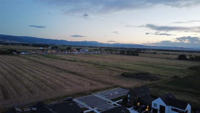 mountain view featuring a rural view