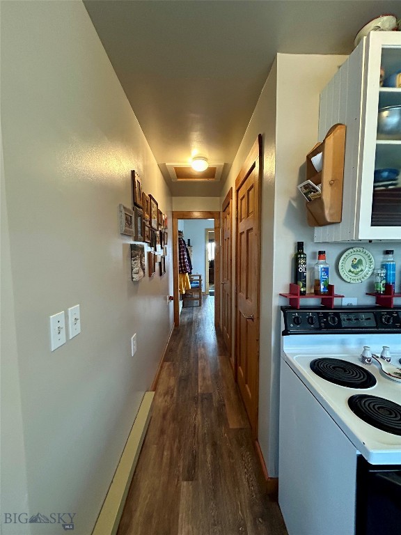 interior space with dark wood-type flooring and electric stove