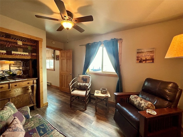 interior space with hardwood / wood-style flooring, a baseboard heating unit, a healthy amount of sunlight, and ceiling fan