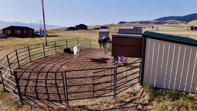 exterior space featuring a rural view and a mountain view