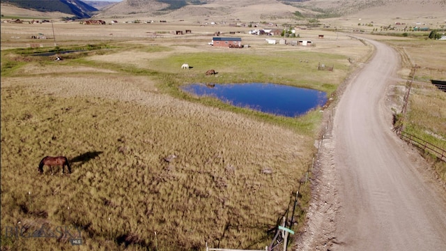 bird's eye view featuring a rural view and a water and mountain view