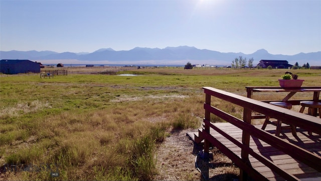 mountain view featuring a rural view