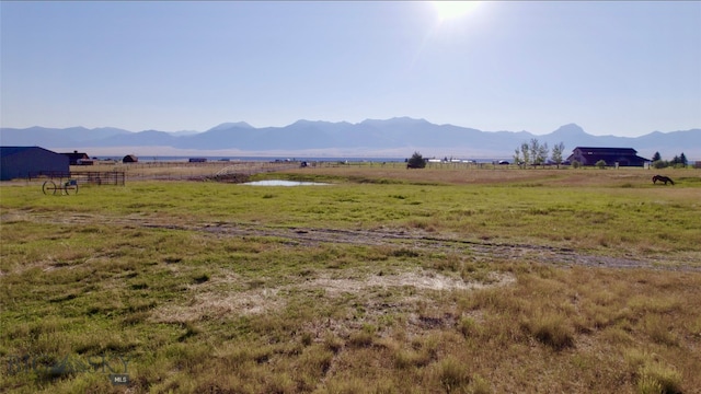 view of mountain feature featuring a rural view