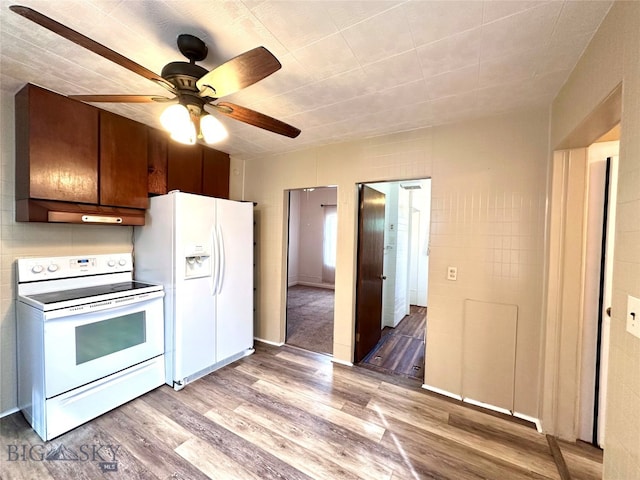 kitchen featuring ceiling fan, wood-type flooring, and white appliances