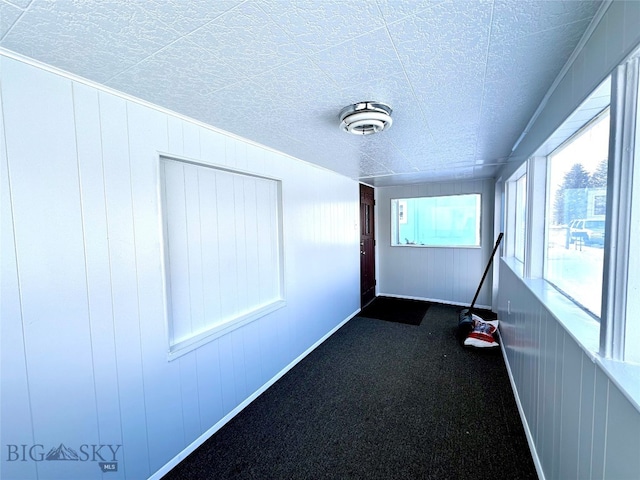 corridor with carpet flooring