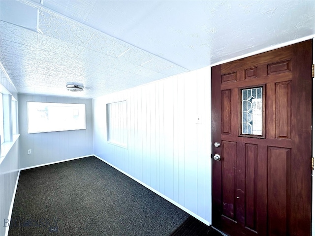 view of carpeted entrance foyer