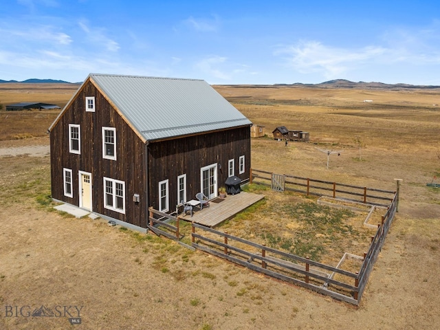 view of outdoor structure with a rural view