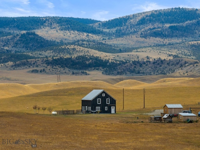 view of mountain feature with a rural view