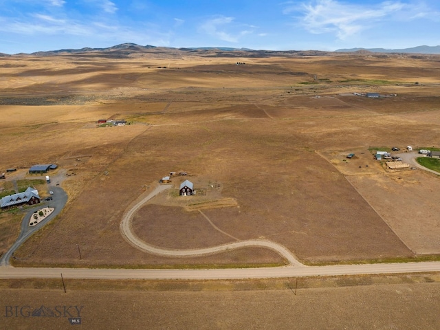 bird's eye view featuring a rural view and a mountain view