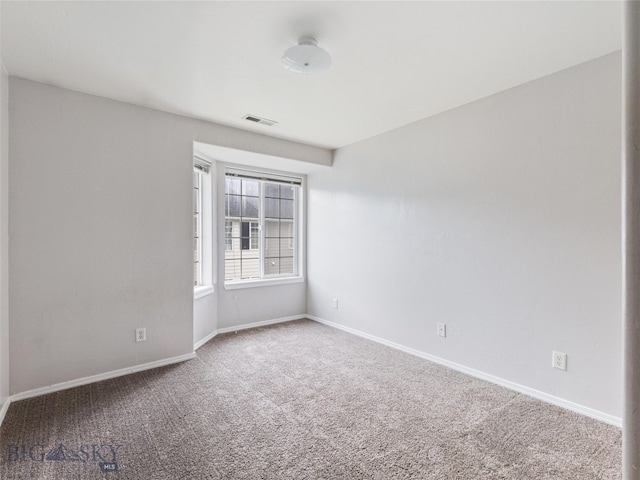 spare room featuring carpet floors