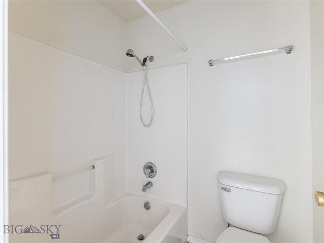 bathroom with bathing tub / shower combination and toilet