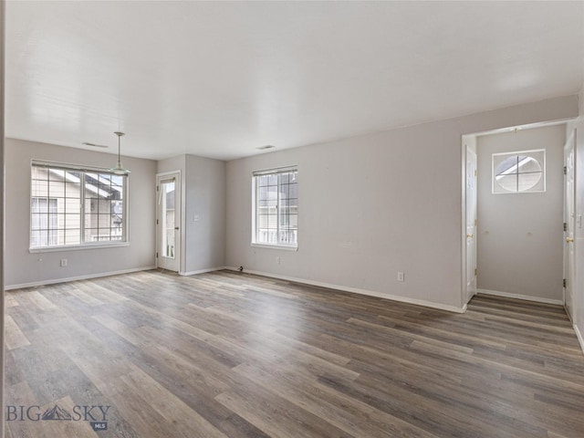 spare room featuring hardwood / wood-style flooring