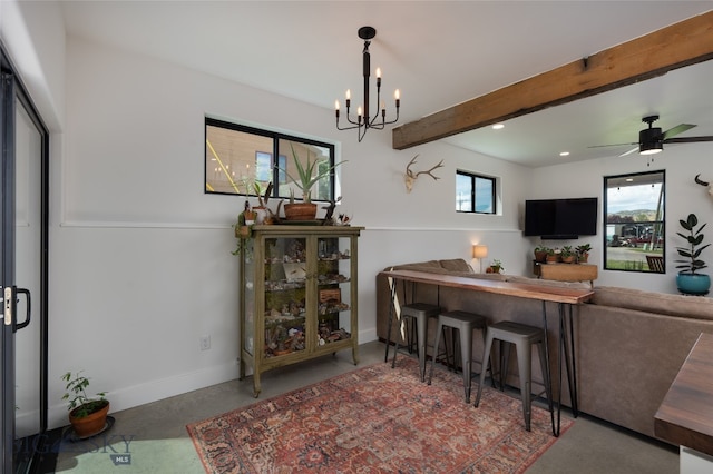 dining area with ceiling fan with notable chandelier, carpet, and beamed ceiling