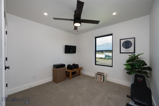 interior space featuring ceiling fan and carpet flooring