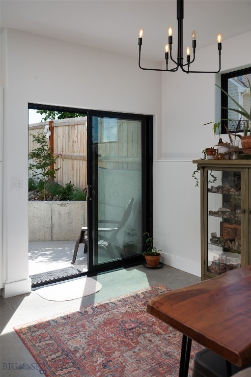 entryway with a notable chandelier