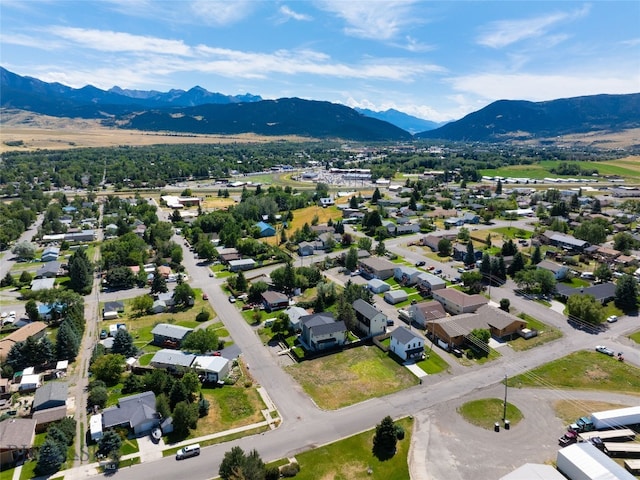 birds eye view of property with a mountain view