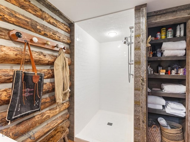 bathroom with a tile shower