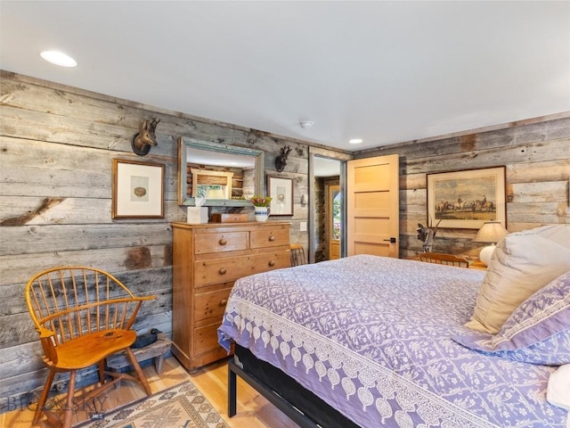 bedroom with wood finished floors and recessed lighting