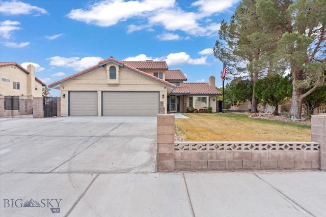 view of front facade with a garage and a front yard