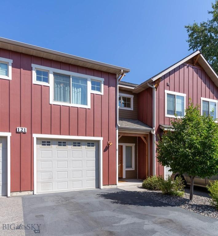 townhome / multi-family property featuring a garage