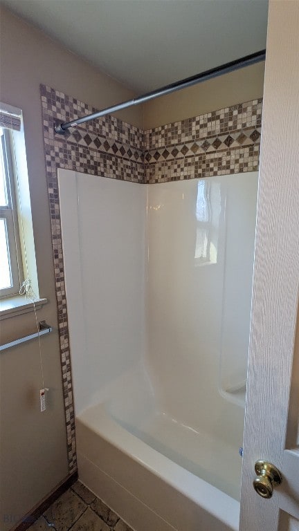 bathroom featuring shower / bathing tub combination and tile patterned floors