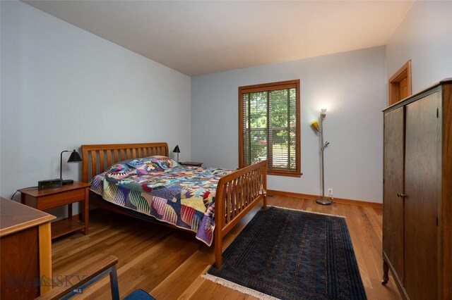 bedroom with light wood-type flooring