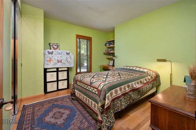 bedroom with light hardwood / wood-style flooring