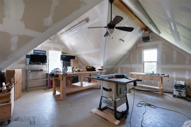 game room with ceiling fan and vaulted ceiling