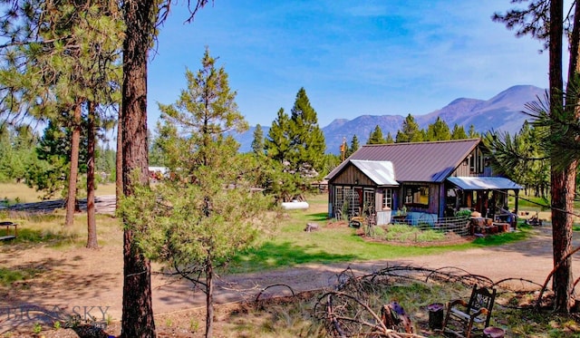 back of property featuring a mountain view