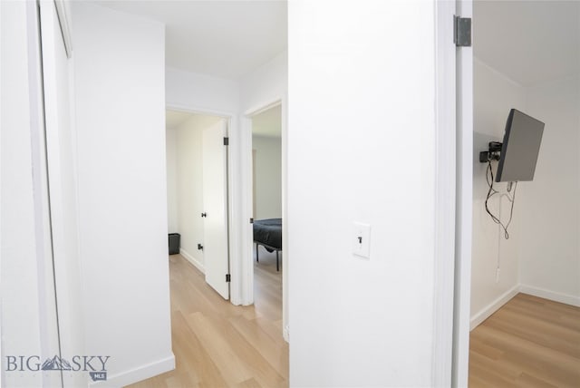 hallway featuring light hardwood / wood-style flooring