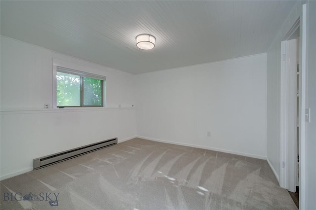 8733 Huffman, Bozeman, MT 59715 - empty room with baseboard heating, baseboards, and carpet floors