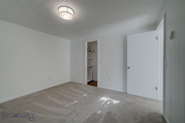 unfurnished room with light carpet