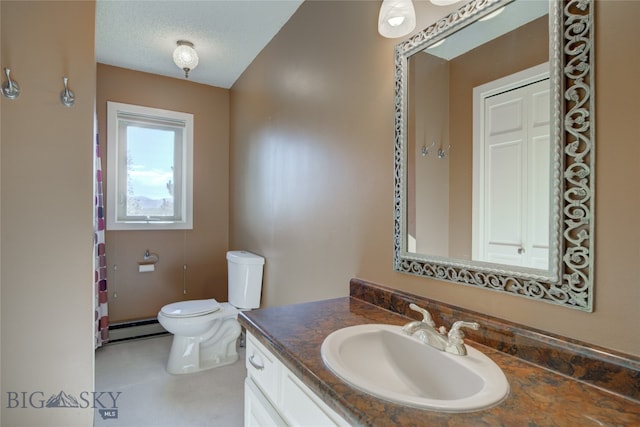 bathroom featuring a baseboard radiator, toilet, a textured ceiling, and vanity