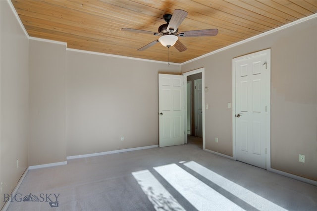 interior space featuring crown molding, ceiling fan, light colored carpet, and wooden ceiling