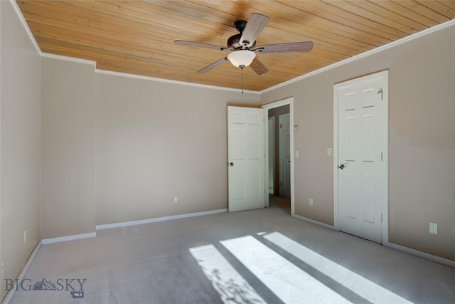 8733 Huffman, Bozeman, MT 59715 - unfurnished bedroom featuring baseboards, carpet floors, crown molding, and wood ceiling