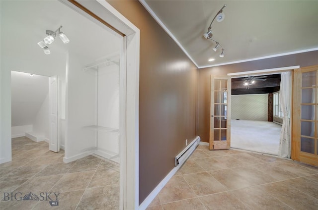 8733 Huffman, Bozeman, MT 59715 - hallway featuring a baseboard radiator, tile patterned floors, ornamental molding, baseboards, and french doors