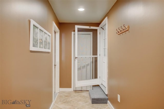 8733 Huffman, Bozeman, MT 59715 - corridor with light tile patterned floors, recessed lighting, and baseboards