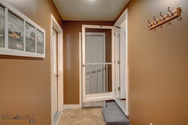 hallway featuring light tile patterned flooring