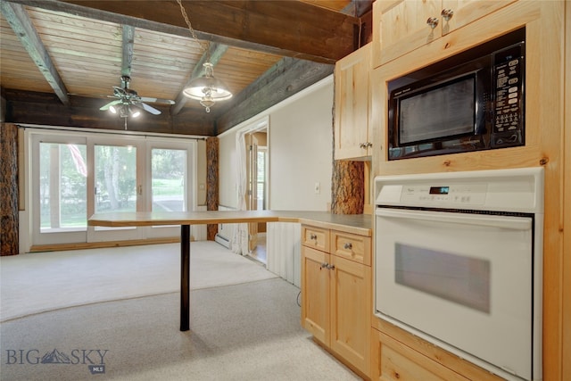 kitchen with oven, wood ceiling, light brown cabinets, ceiling fan, and black microwave