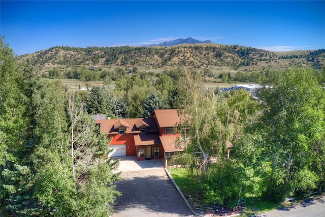 birds eye view of property featuring a mountain view