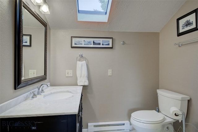 8733 Huffman, Bozeman, MT 59715 - half bathroom with a baseboard heating unit, a skylight, toilet, and a textured ceiling