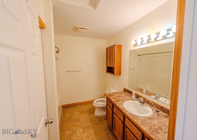 25 Amber, Dillon, MT 59725 - bathroom featuring vanity, washtub / shower combination, toilet, and baseboards